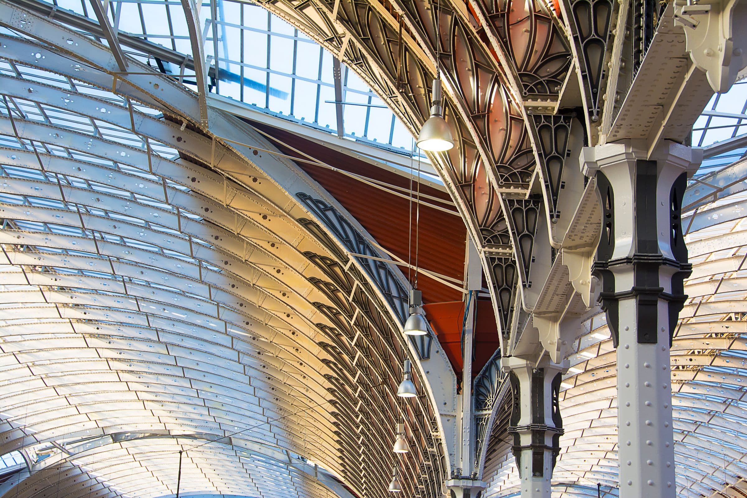 Monumental steel-and-glass vaulted structure, cathedral-scale engineering.