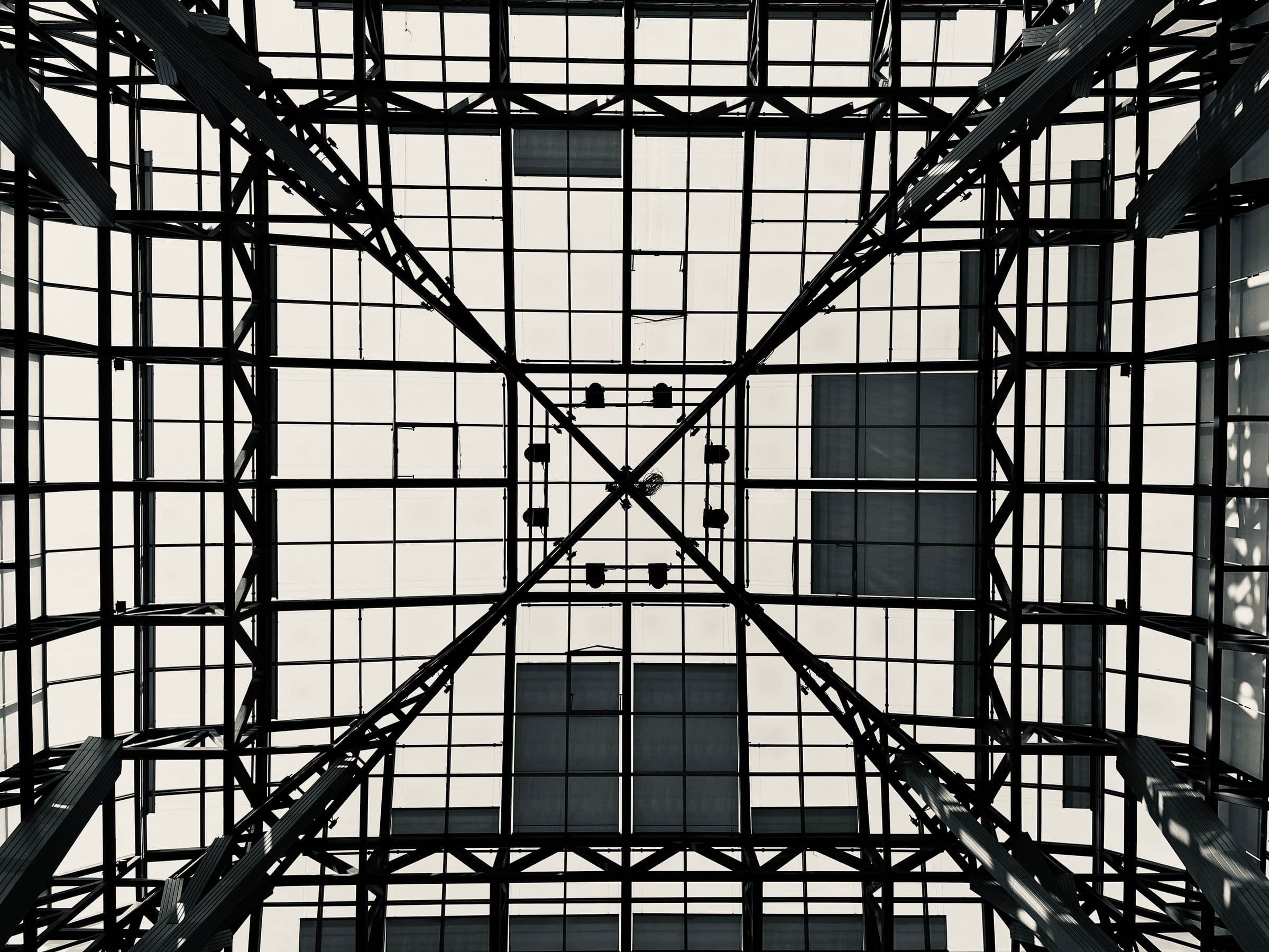 Abstract steel-and-glass architectural geometry.