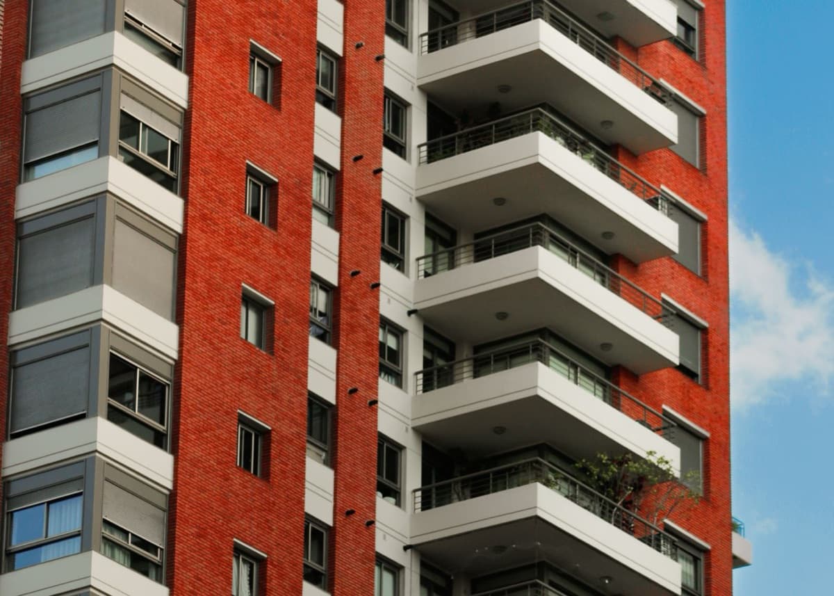 Modern brick residential tower with balconies